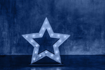Decorative star with lamps in blue color.