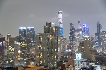 Fototapeta na wymiar Manhattan night skyline with tall skyscrapers