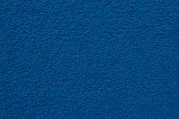 Wall texture painted in blue color.