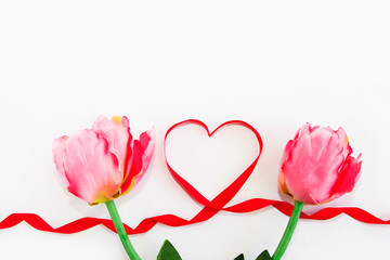 natural pink tulips and red ribbon heart