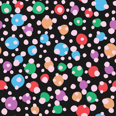 Seamless pattern with rounded spots on dark background. Irregular colorful polka dot. Simple vector illustration.