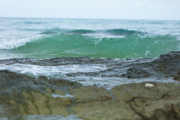 Sea waves ashore close up