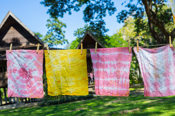 Colorful Abstract tie dyed fabric  hung up to dry.
