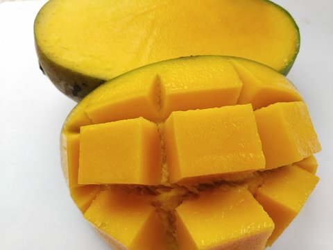 This is a ripe mango, in Bali the mango is called a poh fruit.