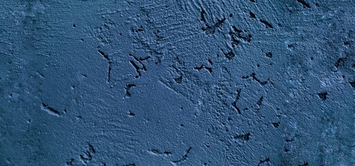 Concrete wall stucco texture in Classic blue color of the year 2020. Banner. Close-up with copy space for text.