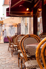 Traditional french cafe on Montmartre in sunny autumn afternoon. France. Paris. Autumn in old town.