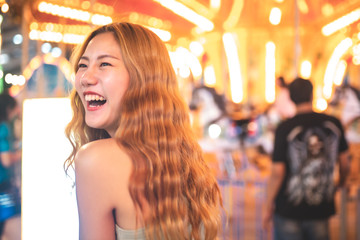 Traveler Asian blogger women travel in Bangkok, Thailand, beautiful female using .Beautiful smiling tourist young  woman having fun at amusement park at hot summer day trip.