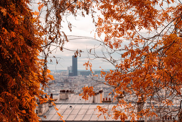 View on Montparnasse through golden trees from Montmartre. Autumn in Paris.