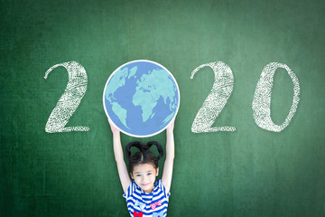 2020 new educational academic calendar year for school class with student kid raising world global planet on teacher's green chalkboard for back to school celebration, classroom schedule 