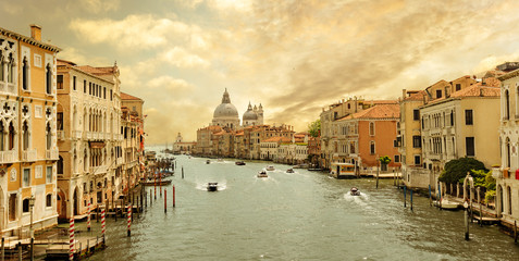 boats navigating in the Grand Canal with church of Santa Maria della Salute in the background, Venice, Italy © Paulista