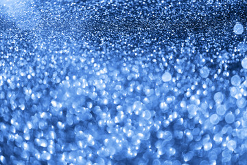 Holiday abstract texture. Christmas card with copy space. ?lassic blue background bokeh, defocused lights.