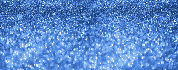Obraz premium Holiday abstract texture. Christmas card with copy space. ?lassic blue background bokeh, defocused lights.