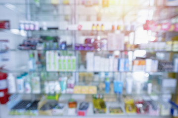 Medicines arranged in shelves at pharmacy.