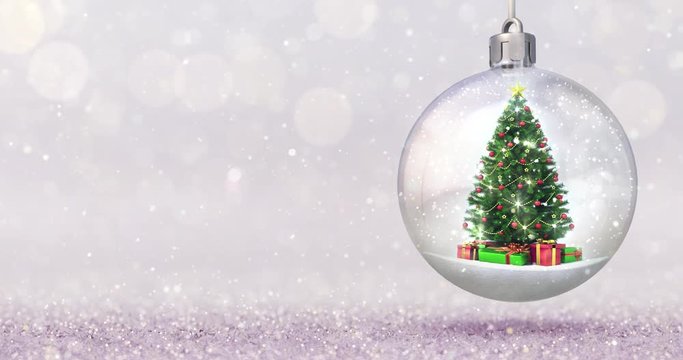 Magic snow ball animation with christmas tree inside on bright bokeh background. Seasonal snowfall 4k video edited as seamless loop.