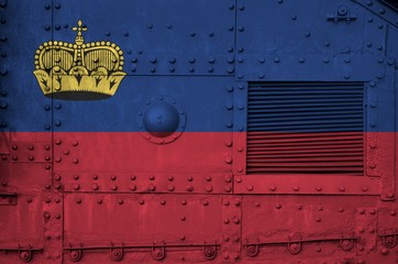 Liechtenstein flag depicted on side part of military armored tank closeup. Army forces conceptual...