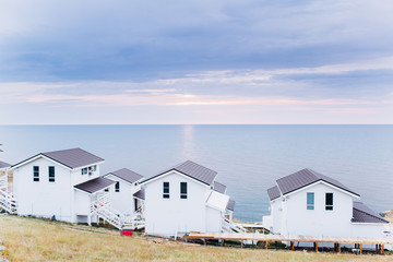 White wooden house by the sea for relaxation. Hotel.
