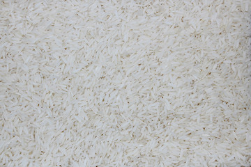 Small raw white rice grain as a background