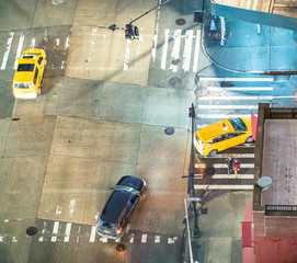 Overhead view of night street traffic and buildings in New York City