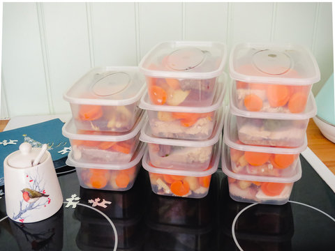 Meal Prep. Stack Of Home Made Christmas Dinners In Containers Ready To Be Frozen For Later Use.