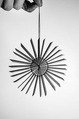 Christmas straw star against isolated white background in black white