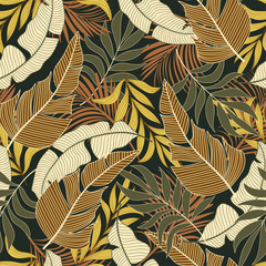 Fashionable seamless tropical pattern with bright yellow and orange plants and leaves on brown background. Jungle leaf seamless vector floral pattern background.Printing and textiles. 