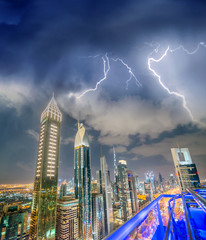 Amazing aerial view of Downtown Dubai skyline from Sheikh Zayed Road with storm approaching, United...