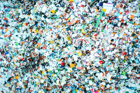background with multicolored carnival confetti, artistic background, blurred vignetting, close-up