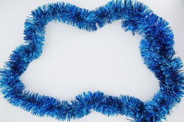 Christmas background. Christmas tinsel on a white background.