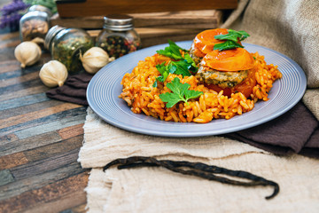 stuffed tomatoes with rice on a white plate