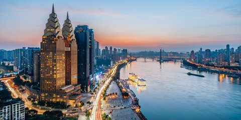 Night view of golden high-rise buildings along the Yangtze River in Chongqing, China - obrazy, fototapety, plakaty