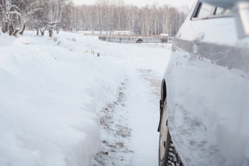 Car on a winter road. Snowy road.