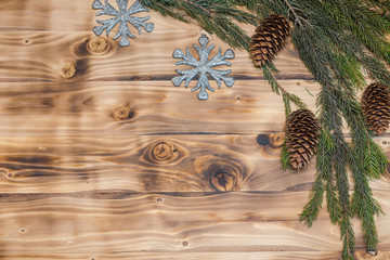Christmas background. Christmas branch of spruce on a wooden background.