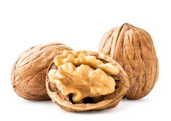 Walnuts and ruined half on a white background. Isolated