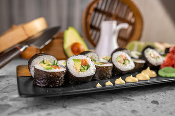 Sushi set with maki roll, fresh salmon and tuna nigiri