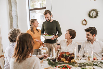 Happy big family celebrating Christmas together at home