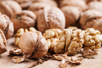 Still life with nuts on natural wood.