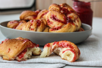 Yeast buns with raspberry jam