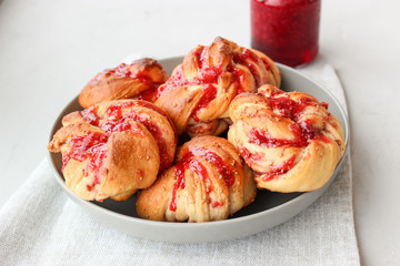 Yeast buns with raspberry jam
