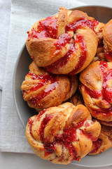 Yeast buns with raspberry jam