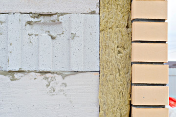 house made of foam concrete insulated with mineral wool and lined with bricks