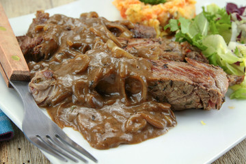 beef steak with shallot sauce and mashed potatoes and carrot