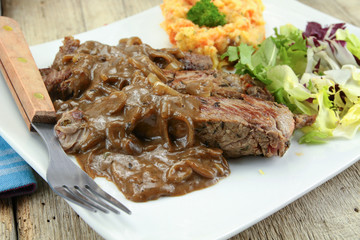 beef steak with shallot sauce and mashed potatoes and carrot