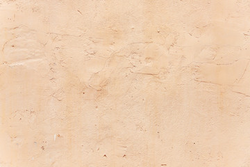 old plastered wall covered with paint