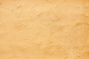 old plastered wall covered with paint