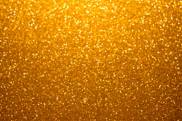 Festive golden bokeh background with sparkling glitter