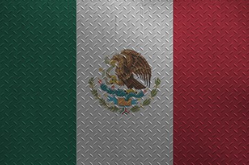 Mexico flag depicted in paint colors on old brushed metal plate or wall closeup. Textured banner on...