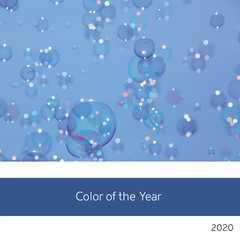 Fototapeta na wymiar Soap bubbles and blue sky colour of the year 2020