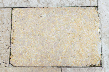  the wall is faced with old yellow stone