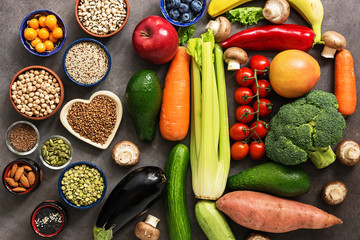 Healthy eating. The concept of vegan and vegetarian food. A variety of vegetables, fruits, legumes, cereals, seeds, nuts, berries. View from above