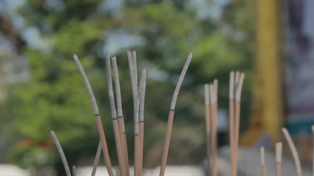 Incense sticks burning in temple.